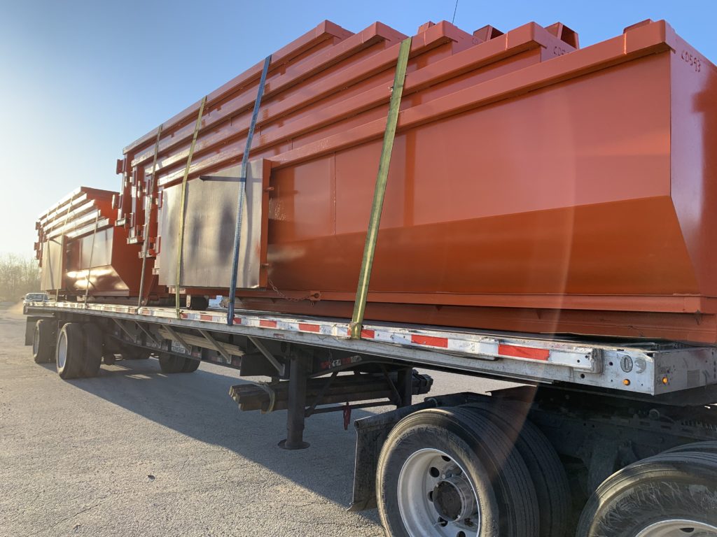 New 20 yard orange dumpsters being delivered.